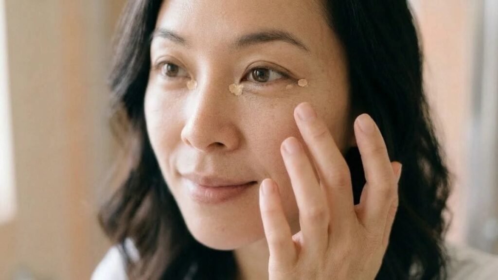 Concealer dots at the eye corners, a step in how to cover dark circles with makeup