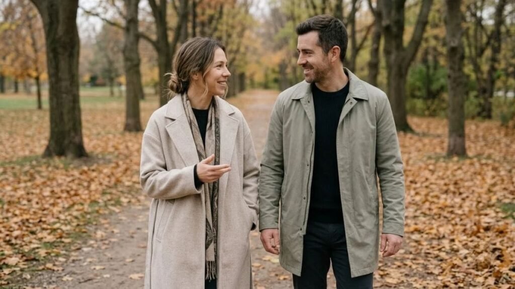 Couple walking hand in hand on an autumn path